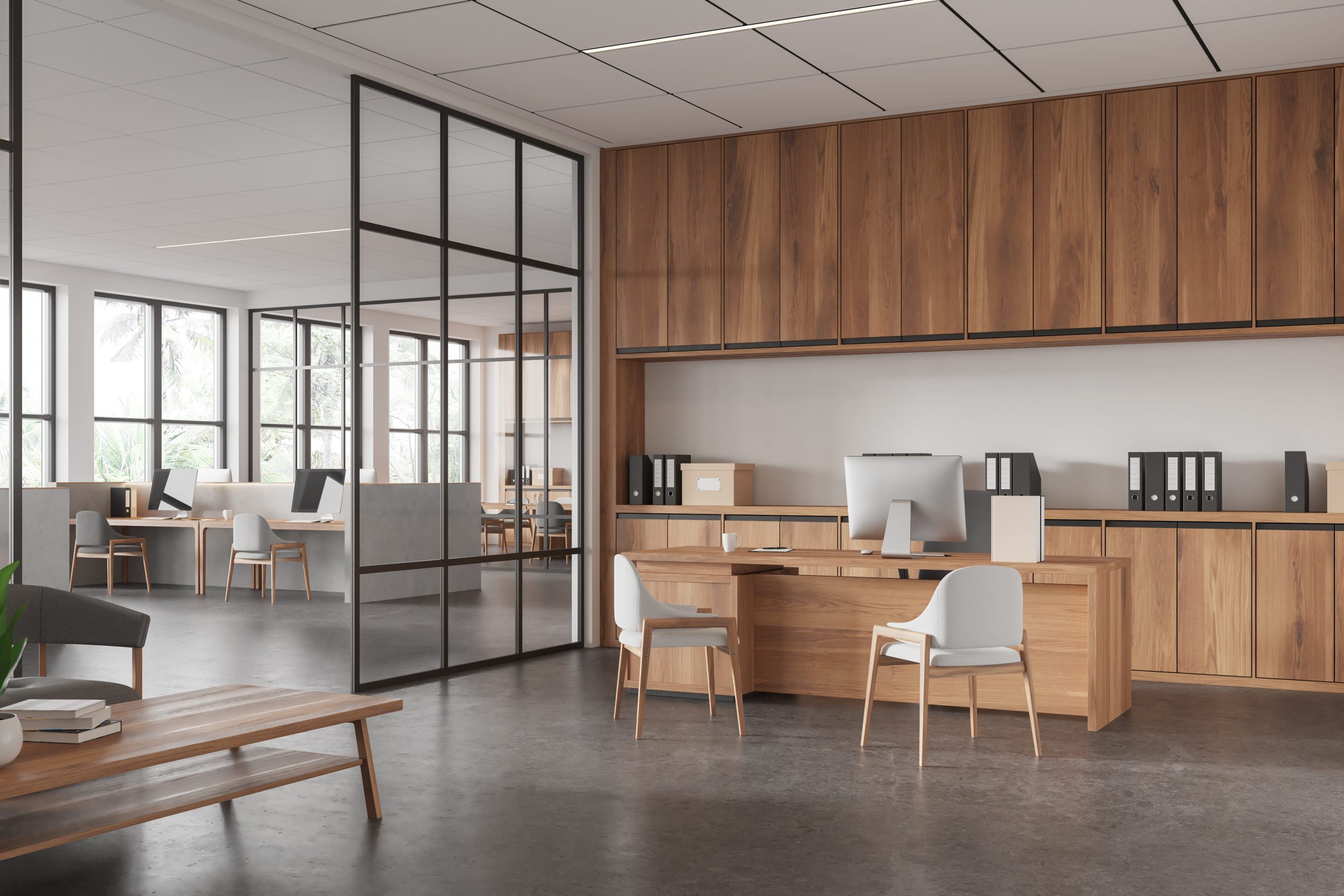 Oficina moderna con luz natural y materiales cálidos como base biofílica